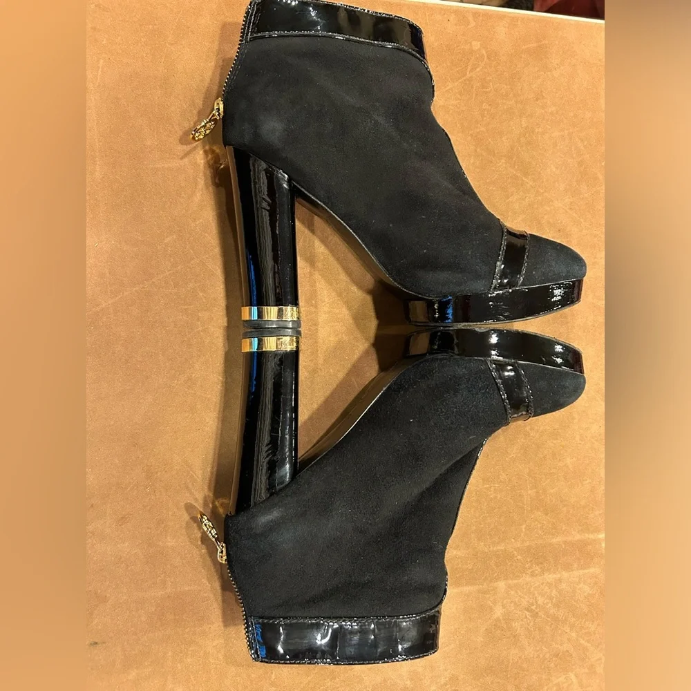 Tory Burch women’s black suede ankle boot with black leather and gold tr…